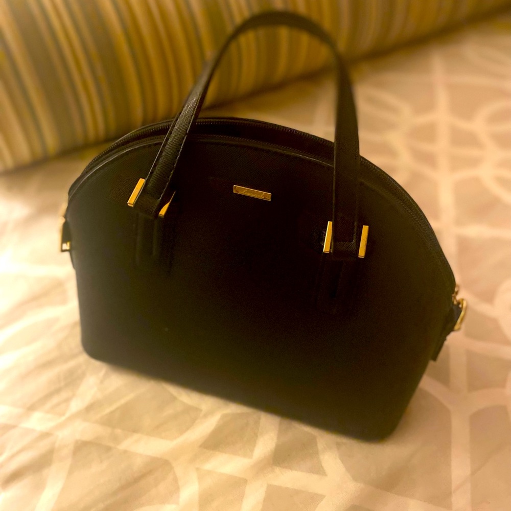 Black bag. Perfect for the essentials!  Excellent condition